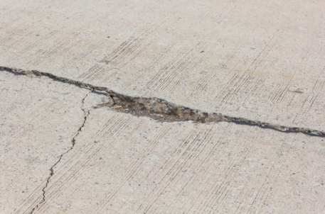 Cracked concrete sidewalk in Louisville, KY