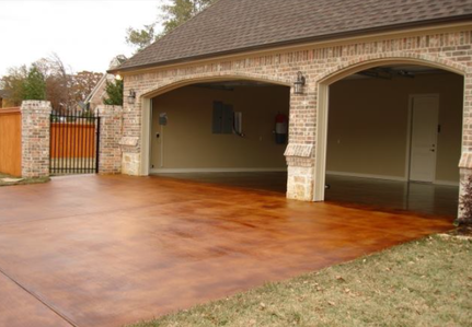 Stained concrete driveway in Terra Cotta color